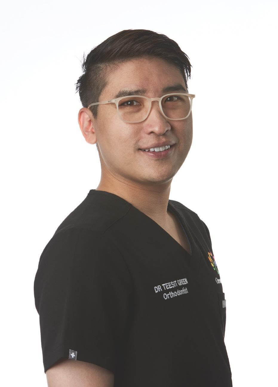 OrthoBoutique - Dr. Tee image wearing his Dentist uniform